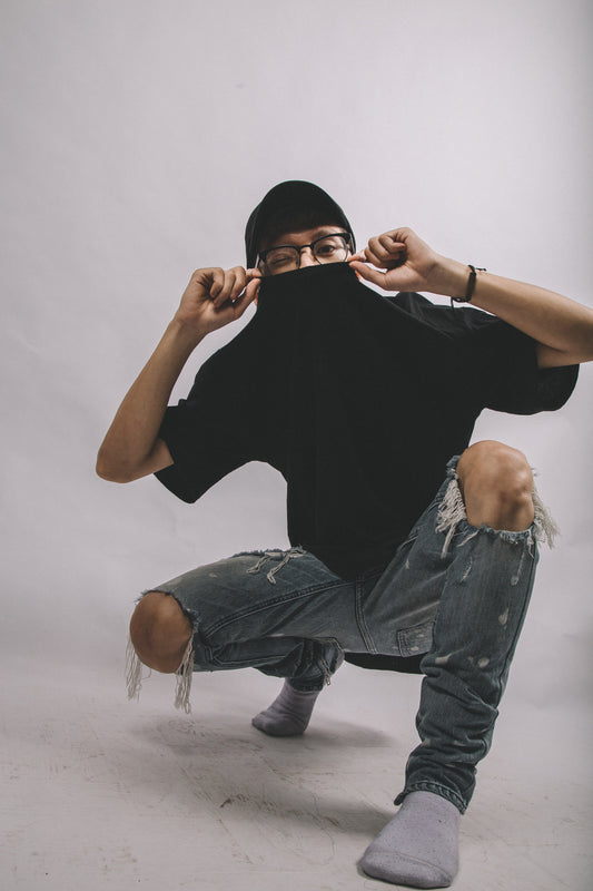 Man with a black shirt sitting